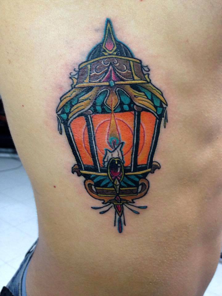 Candle Lamp Tattoo On Side Rib by Daniel Rozo
