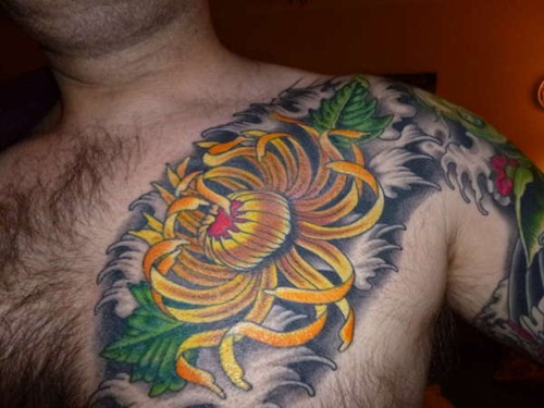 Colored Chrysanthemum Tattoo On Man Front Shoulder
