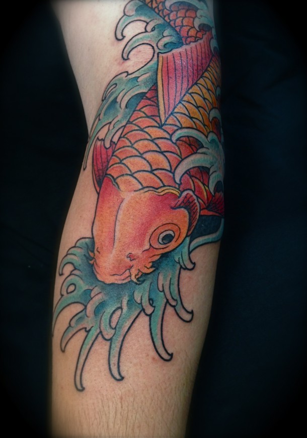 Colored Dragon Fish Tattoo On Left Sleeve