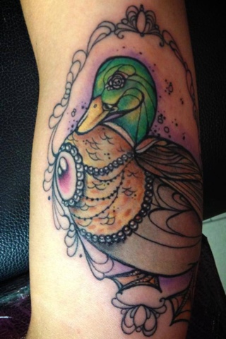 Colored Duck Tattoo On Left Sleeve