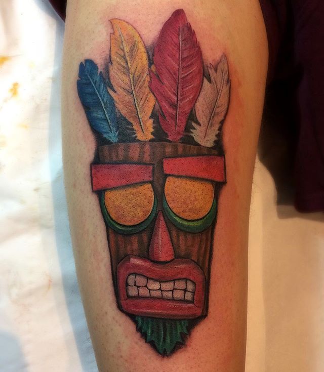 Crash Bandicoot Aku Aku Tattoo On Leg