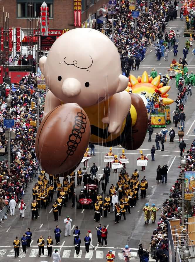 Cute Little Kid With Hand Ball Balloon Float During Thanksgiving Parade