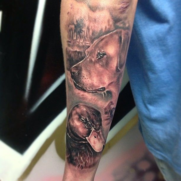 Dog And Duck Tattoo On Right Forearm