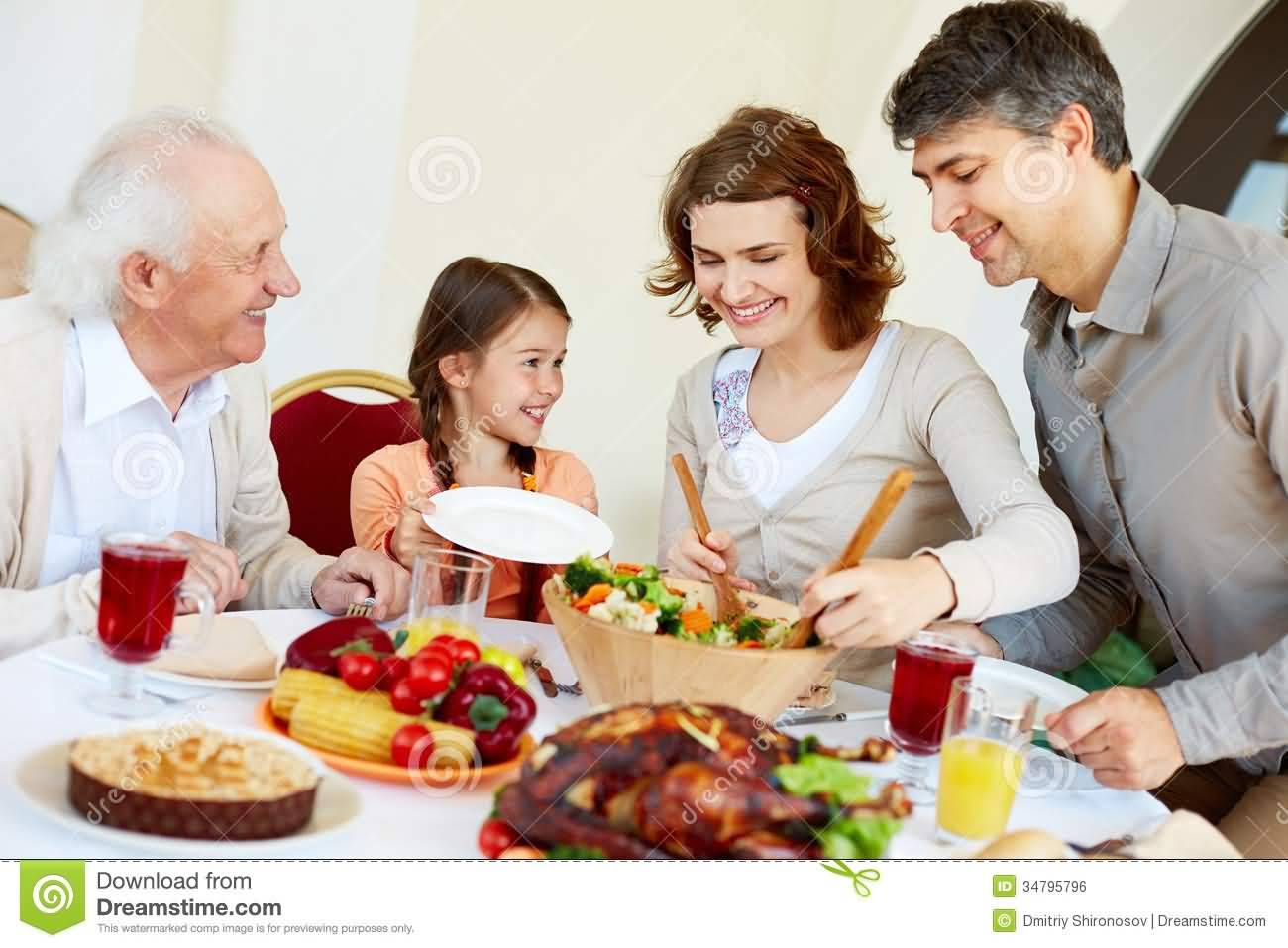 Family Enjoying Dinner During Thanksgiving Day Celebration Picture