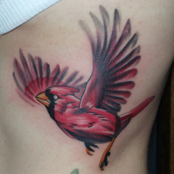 Flying Cardinal Bird Tattoo On Side Rib
