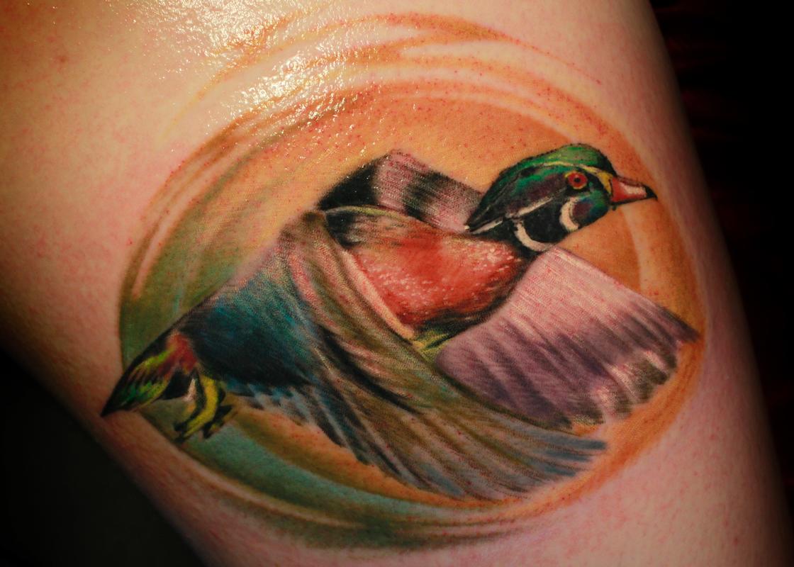 Flying Colored Duck Tattoo