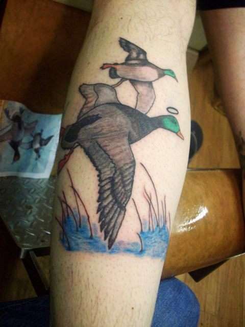 Flying Duck Tattoos On Back Leg