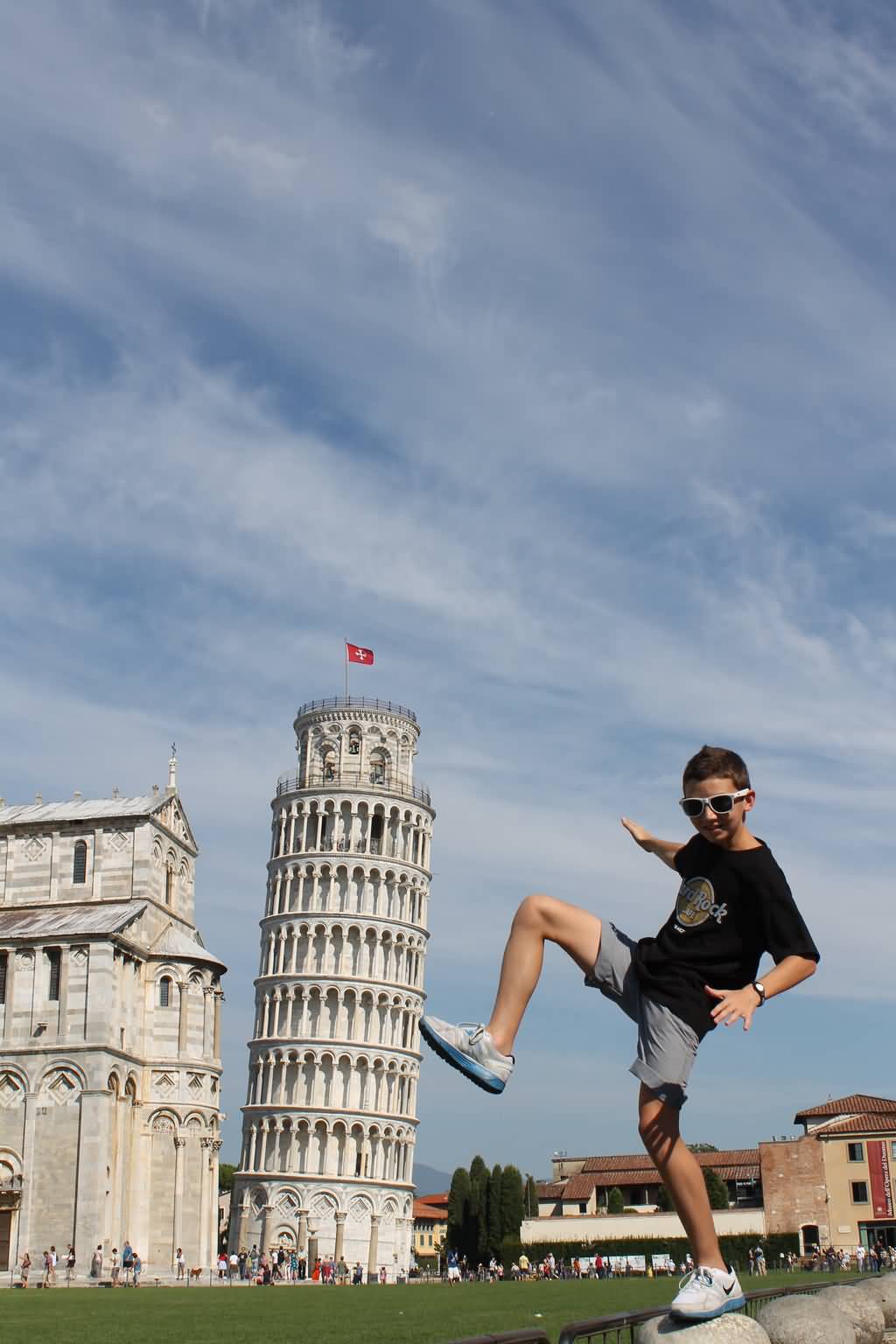 Hitting The Leaning Tower With Leg Optical Illusion