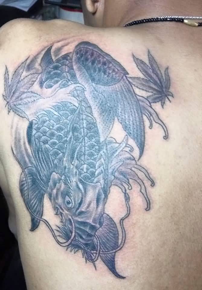 Marijuana Leaves And Dragon Fish Tattoo On Left Back Shoulder