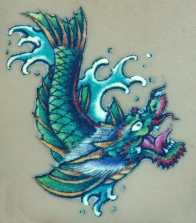 Nice Colorful Dragon Fish Tattoo Design