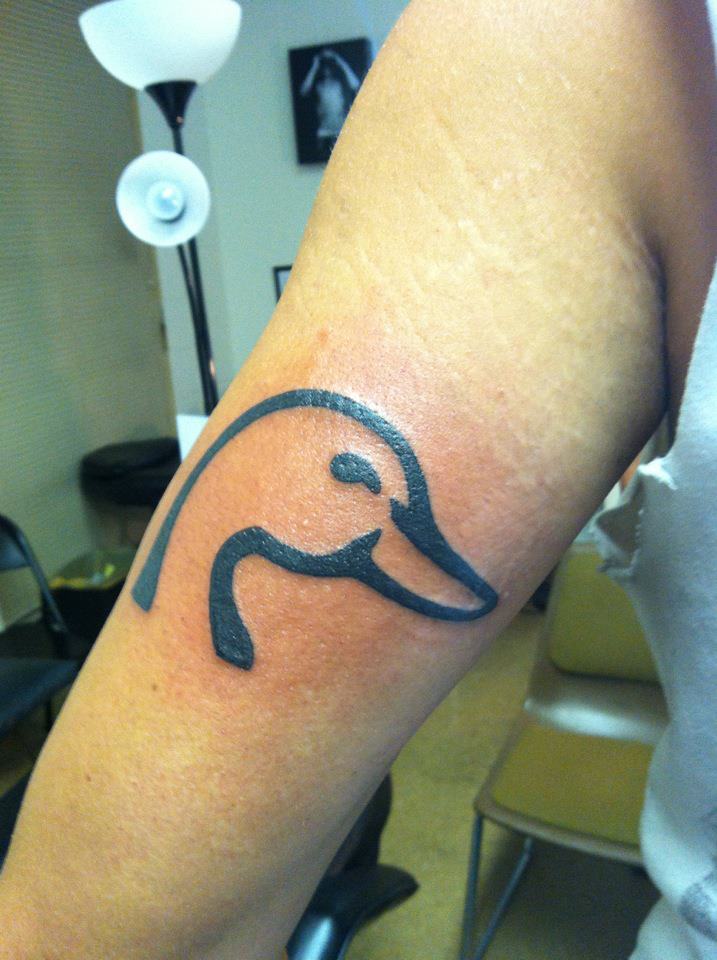 Outline Duck Head Tattoo On Bicep