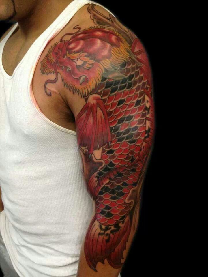 Red And Black Dragon Fish Tattoo On Left Sleeve