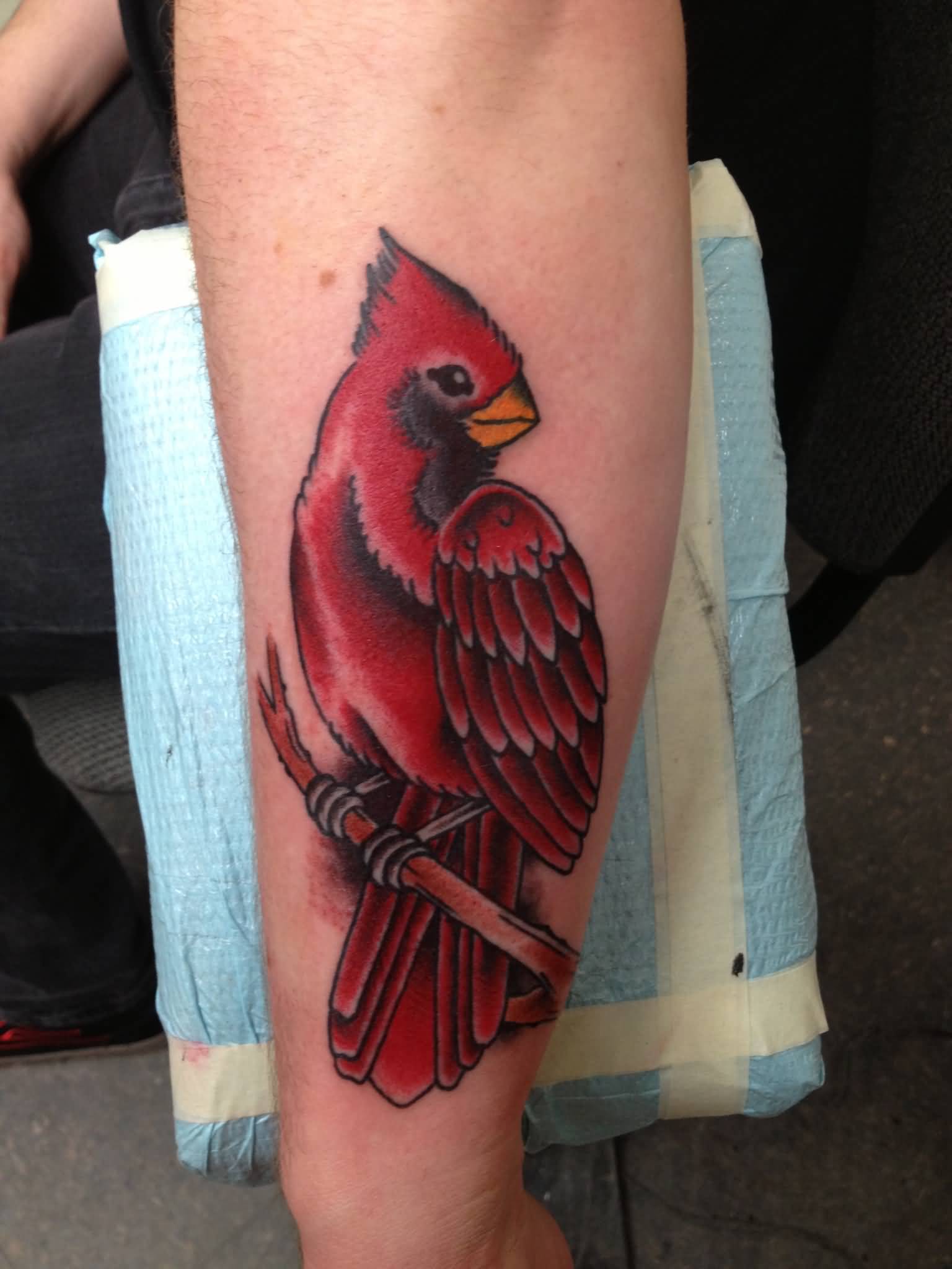 Red Ink Cardinal Bird Tattoo On Left Sleeve