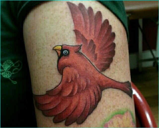 Red Ink Flying Cardinal Bird Tattoo On Left Bicep
