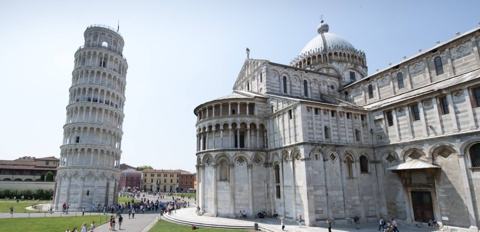 Side View Of Pisa Cathedral And Leaning Tower