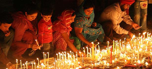 Sikh Devotees Lighting Candles On The Occasion Of Guru Nanak Jayanti