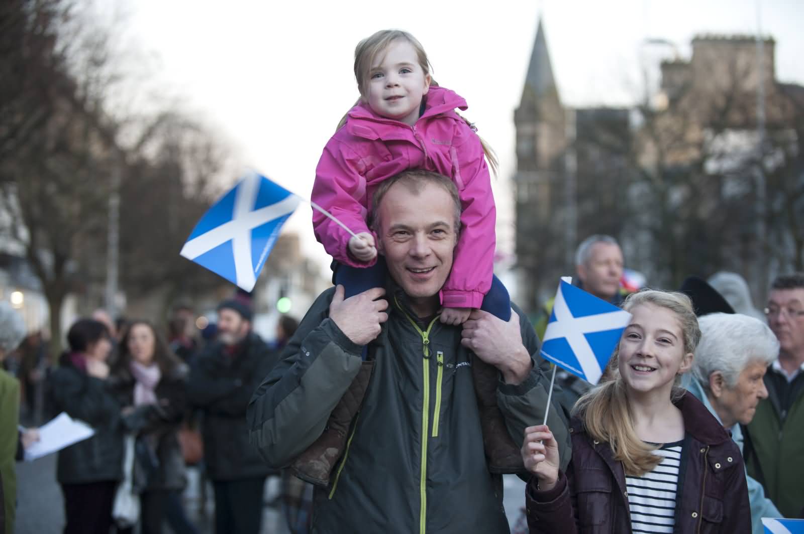St. Andrew's Day Parade Kids On Father's Shoulder With Scotland Flag