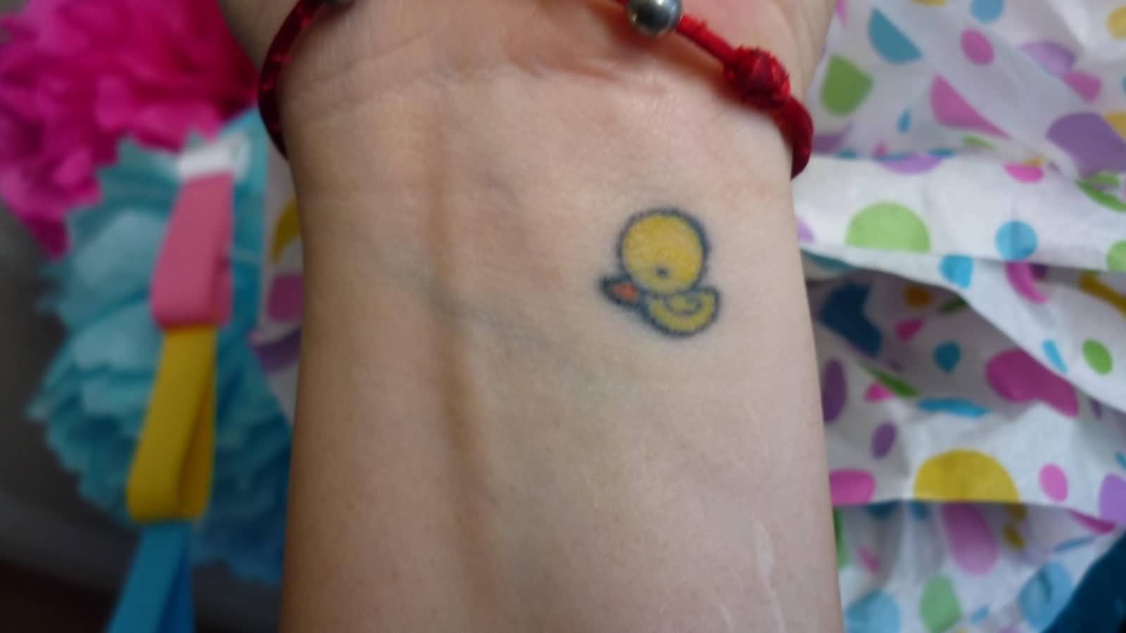 Tiny Duck Tattoo On Left Wrist