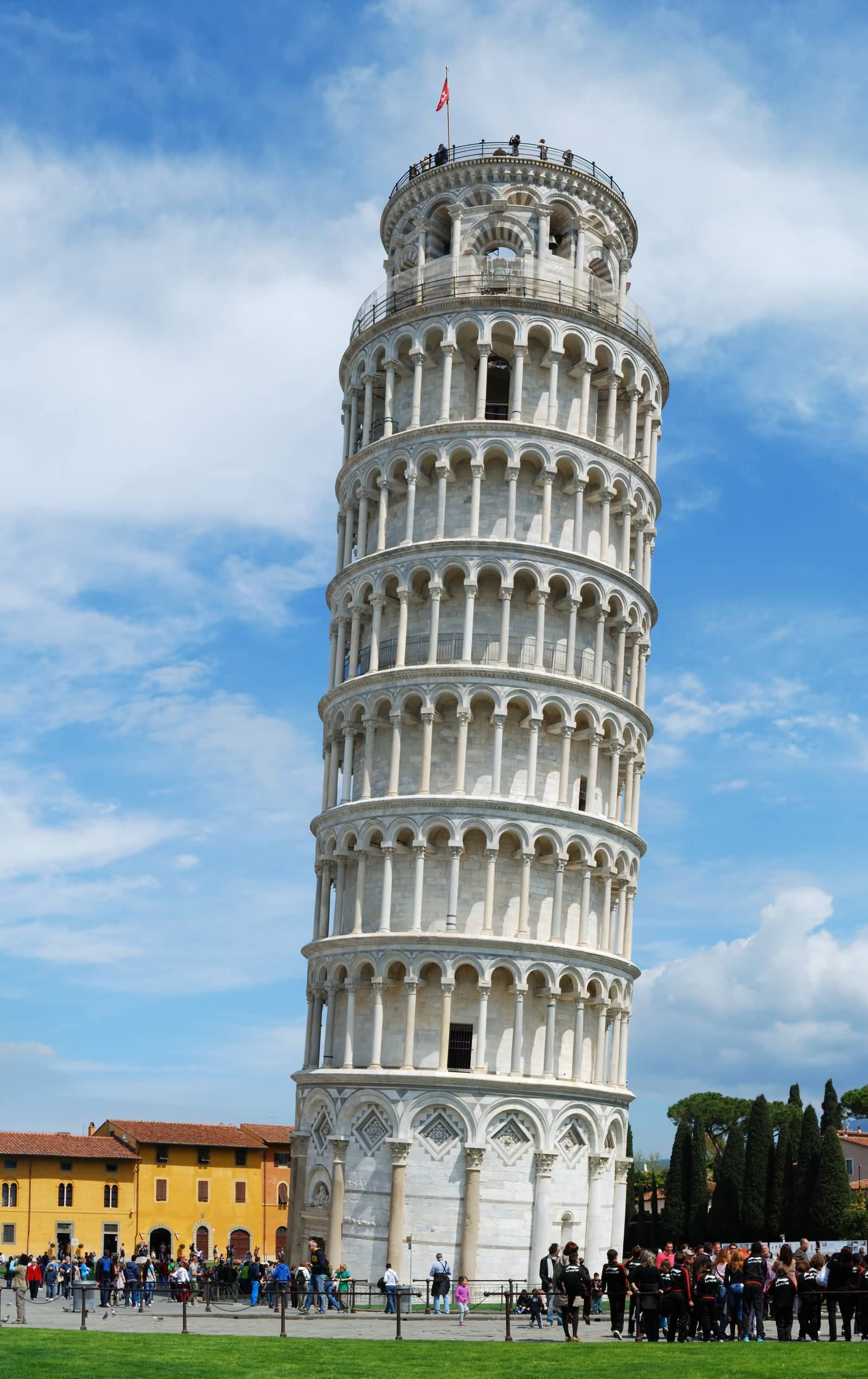 Tourists Enjoying The View Of Leaning Tower of Pisa In Italy
