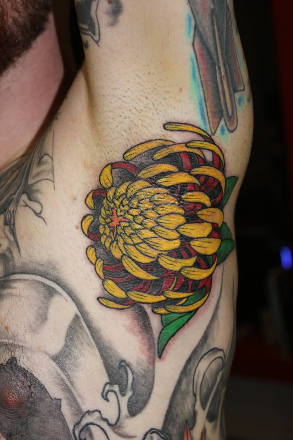 Yellow And Red Ink Chrysanthemum Tattoo On Armpit