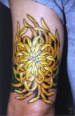 Yellow Chrysanthemum Flower Tattoo On Thigh
