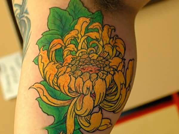 Yellow Ink Chrysanthemum Tattoo On Bicep