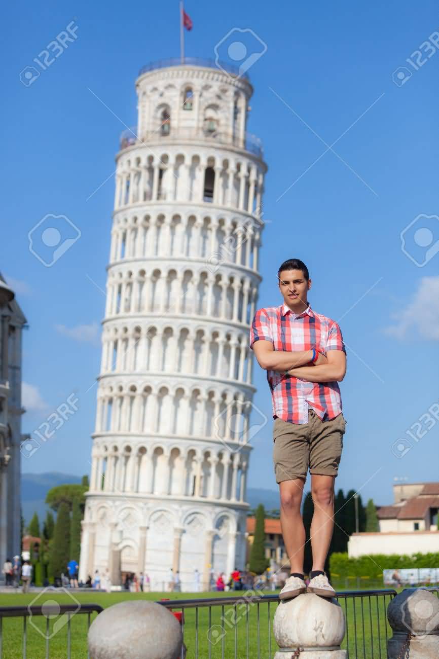 Young Boy Posing With Leaning Tower Of Pisa