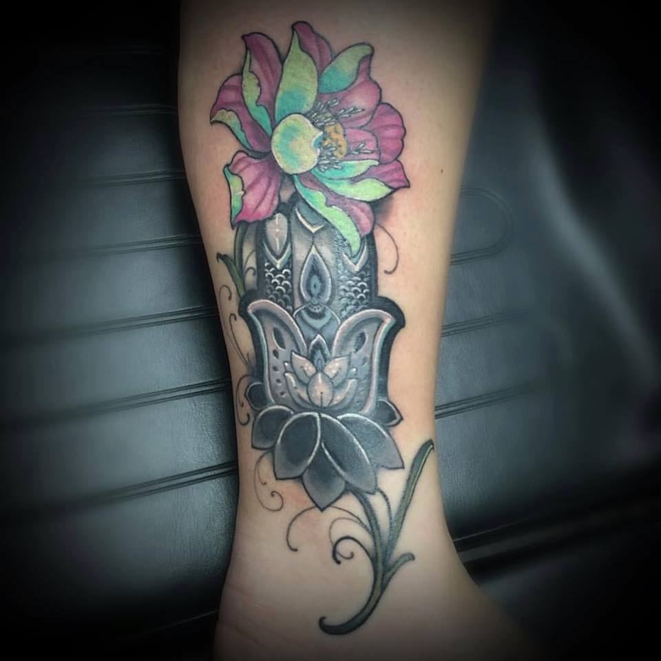 Beautiful Flower And Hamsa Tattoo On Leg by Revolt Tattoos