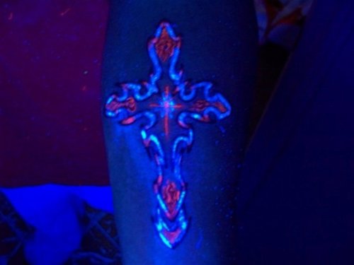 Black Light Cross Tattoo On Left Forearm