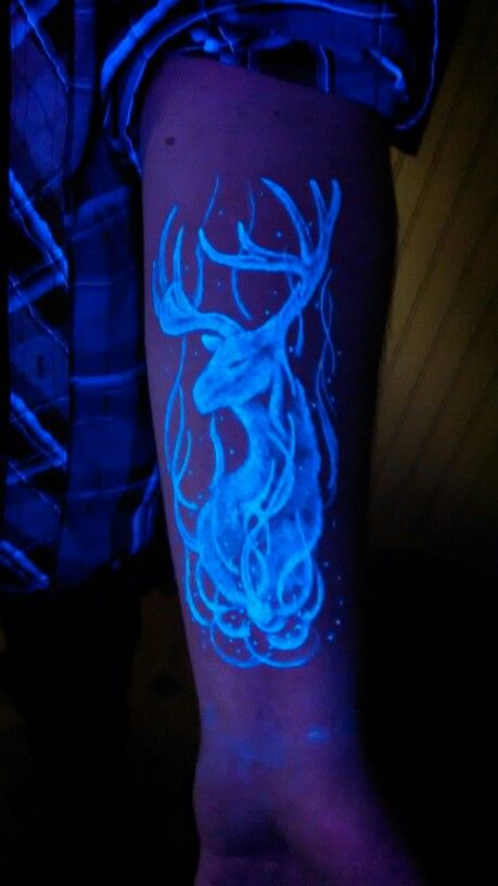 Black Light Deer Head Tattoo On Left Forearm