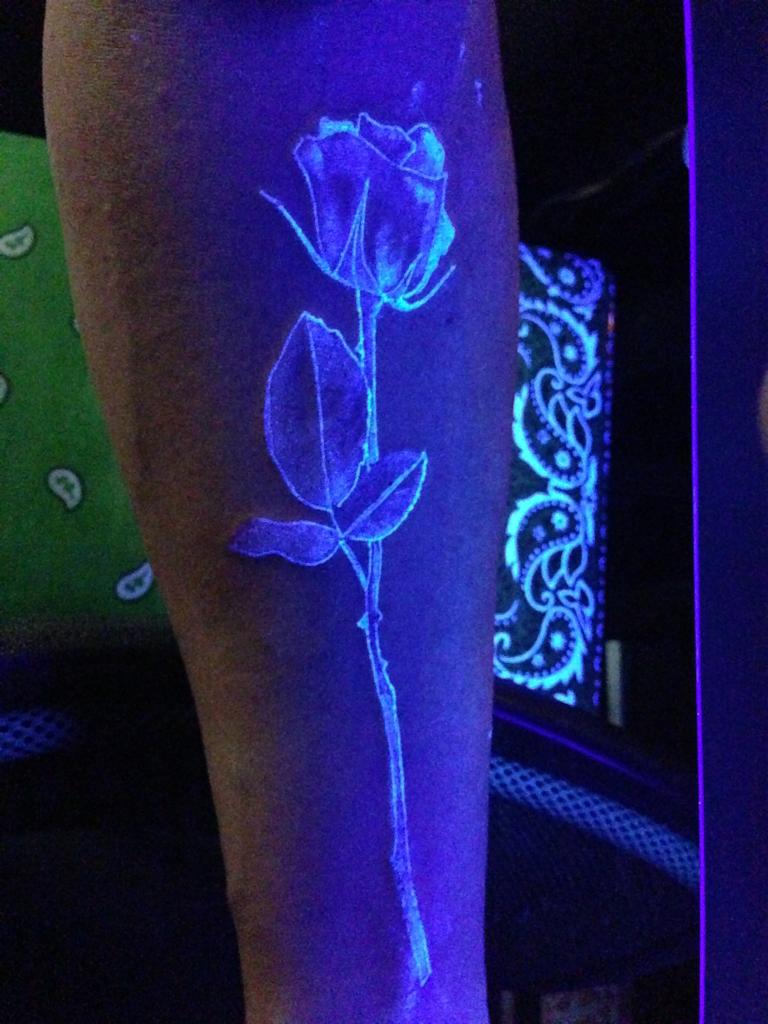 Black Light Rose Tattoo On Arm