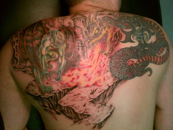 Goblin Tattoo On Man Upper Back.