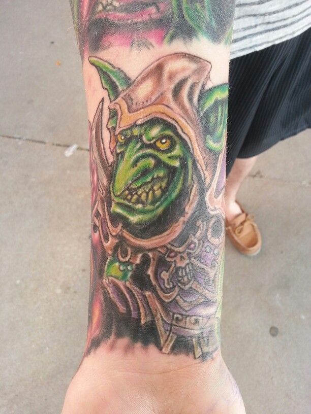 Green Ink Goblin Tattoo On Forearm