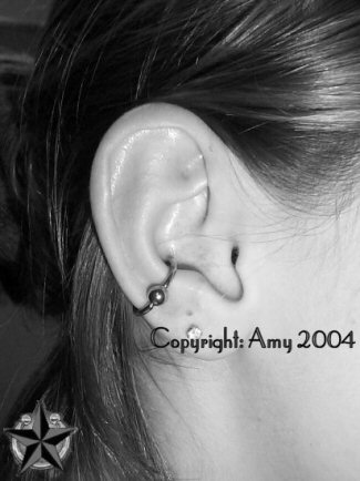 Inner Conch Piercing With Bead Hoop Ring