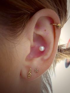 Inner Conch Piercing With White Pearl