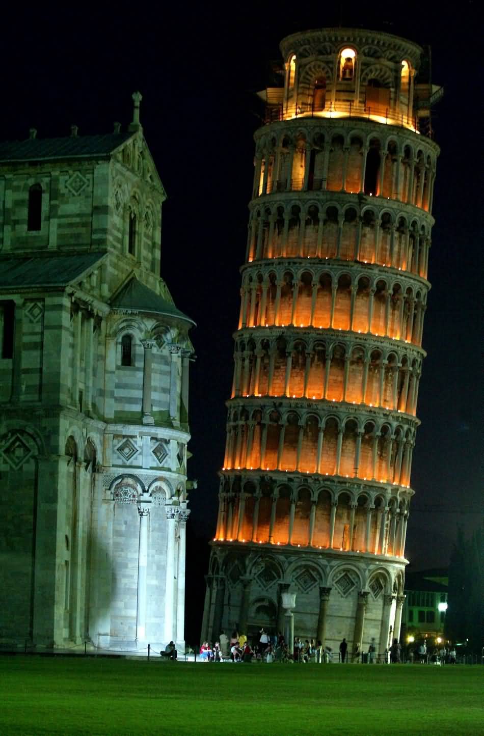 Side View Of St. Mary Cathedral And Leaning Tower Of Pisa At Night