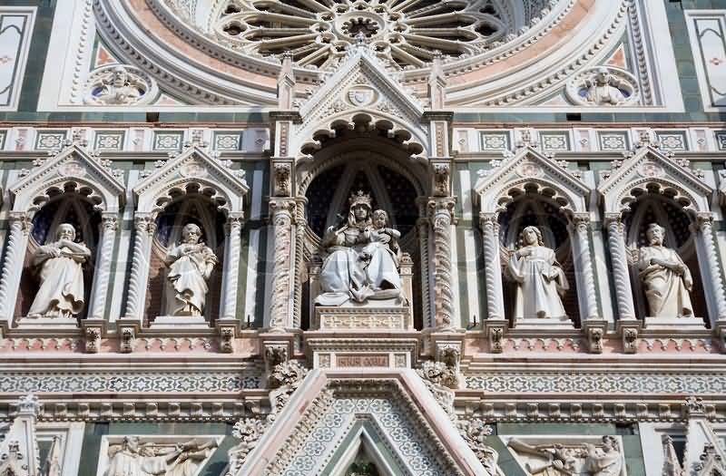 St. Mary Statue On The Front Facade Of Florence Cathedral In Italy