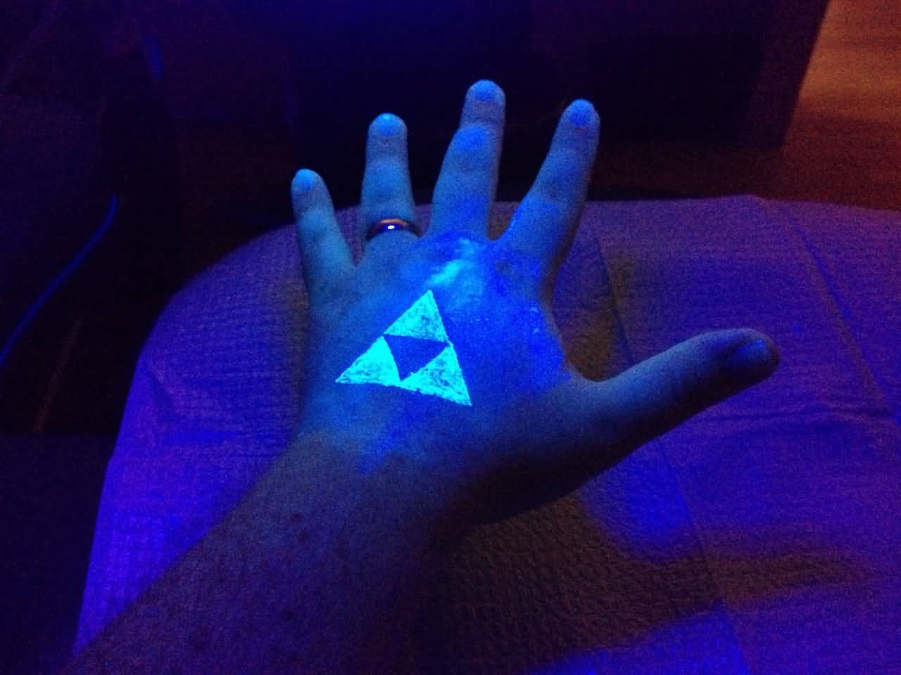 Triangle Black Light Tattoo On Left Hand
