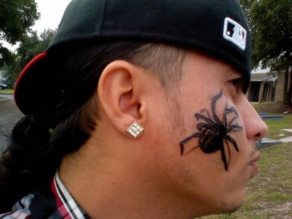 Arachnids Tattoo On Guy Face