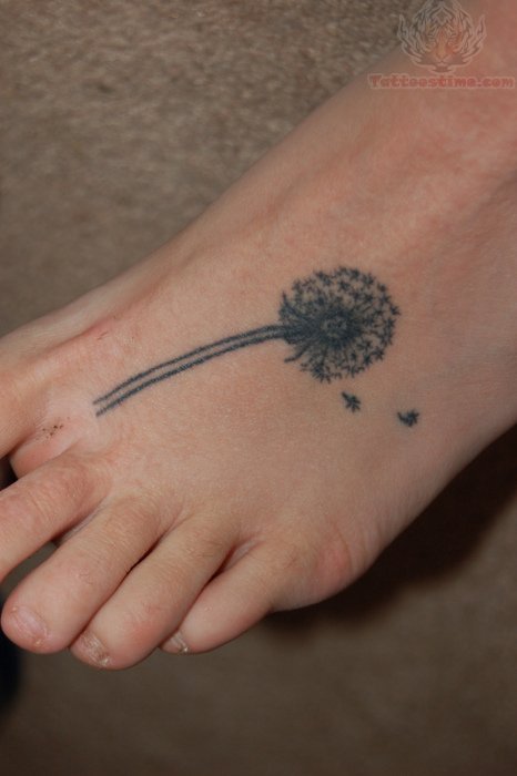 Beautiful Dandelion Puff Tattoo In Black Ink On Foot