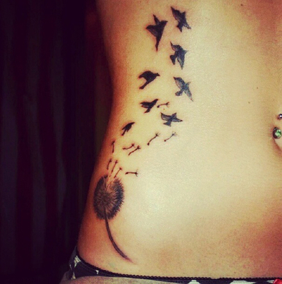 Birds Flying From Dandelion In Dark Grey Ink Tattoo On Right Hip