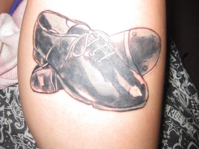 Black And Grey Shoes Tattoo On Side Leg