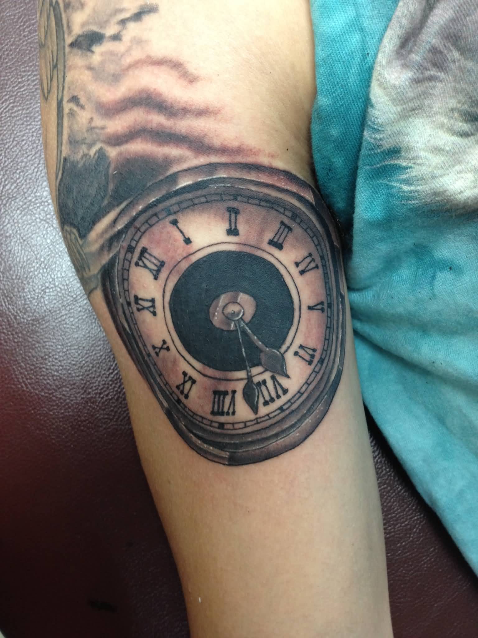 Black And Grey Ink Clock Tattoo On Sleeve