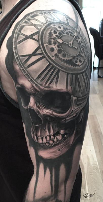 Black And Grey Skull And Clock Tattoo On Left Shoulder