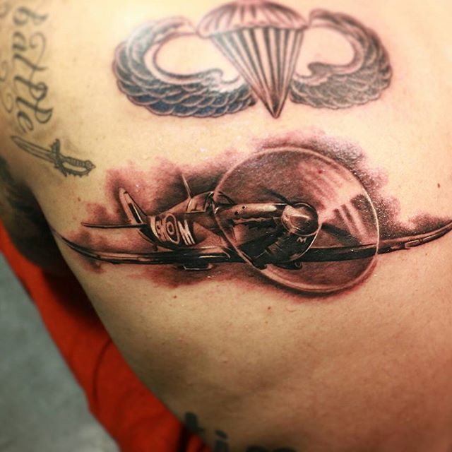 Black And Grey Spitfire Tattoo On Left Back Shoulder