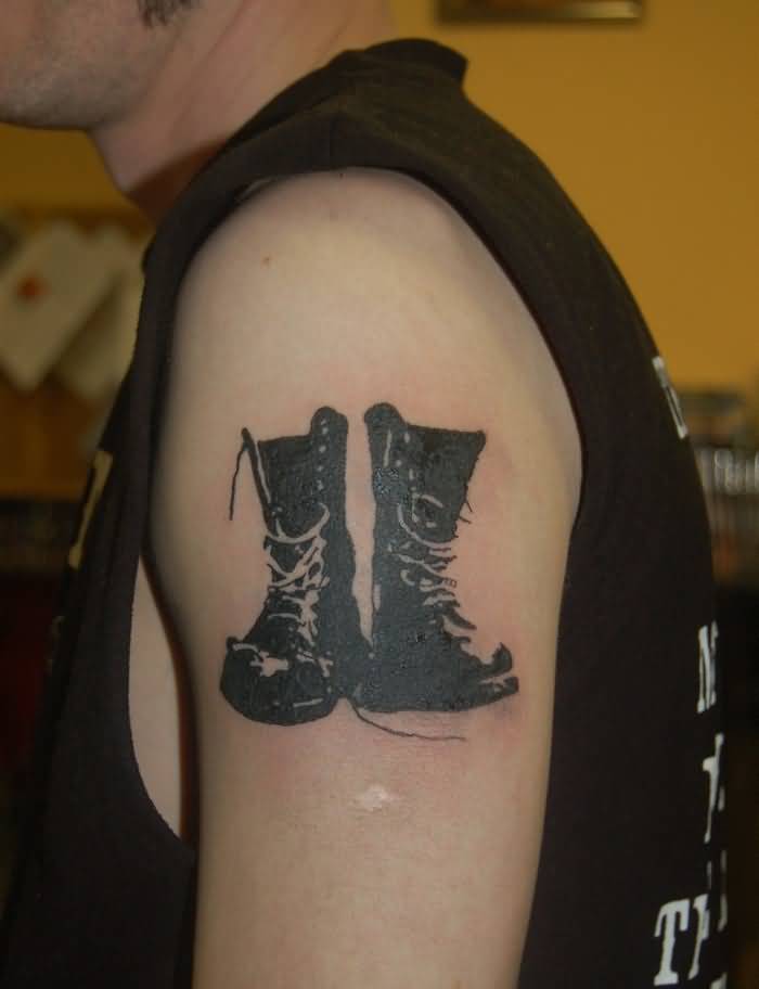 Black And White Shoes Tattoo On Left Shoulder