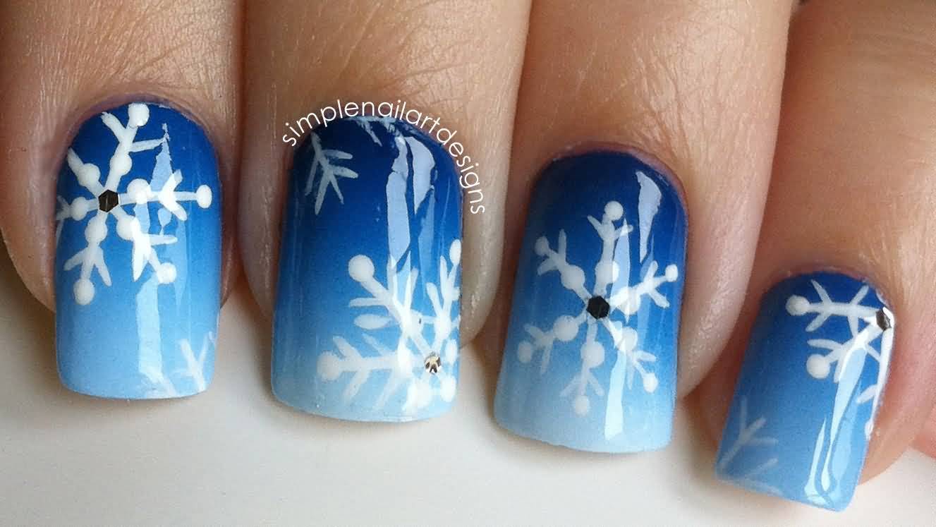 Blue And Black Ombre Nail Art With White Snowflakes Design