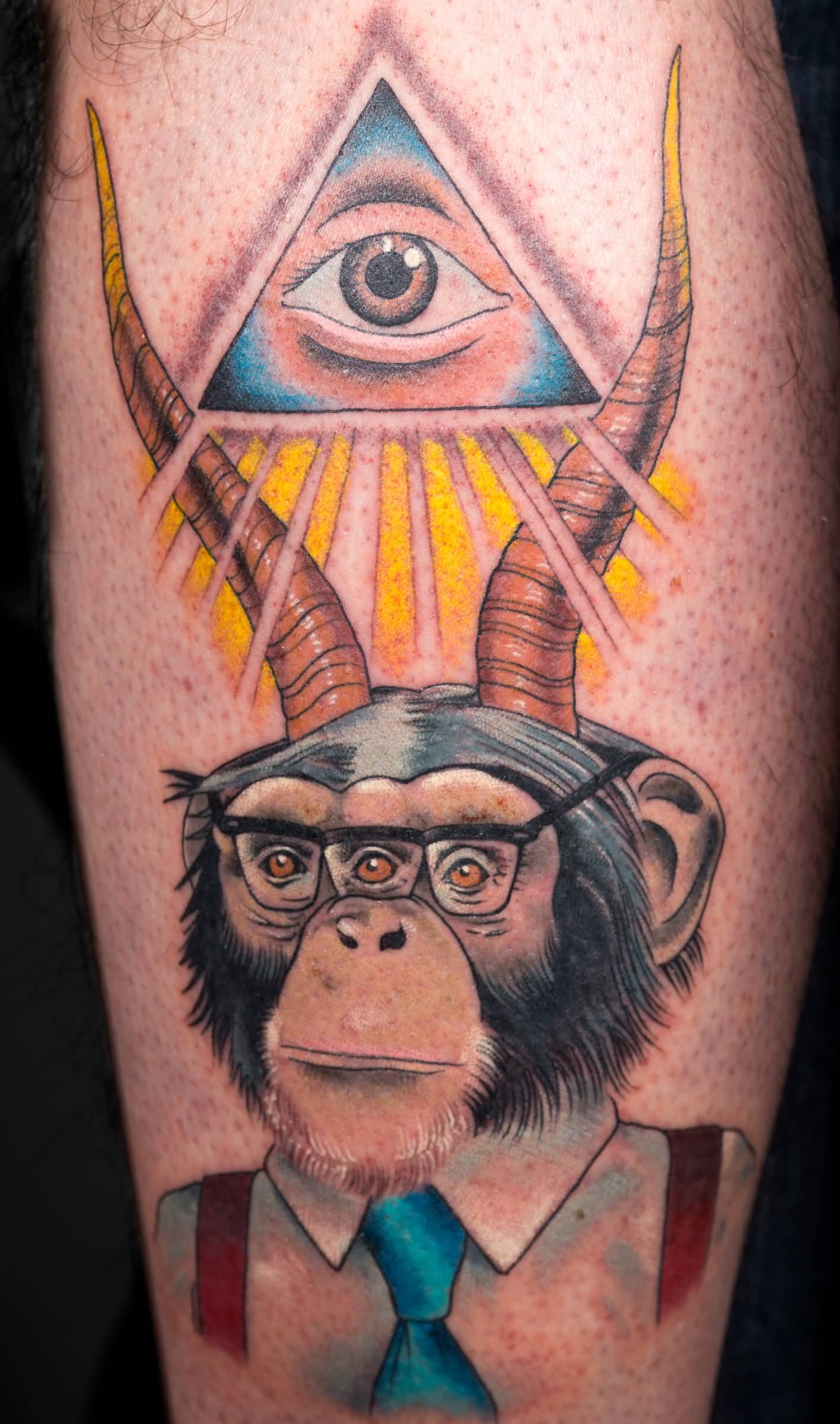 Chimpanzee With Horns And Triangle Eye Tattoo On Leg