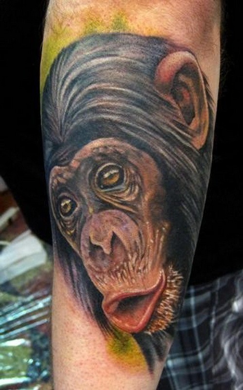 Colored Chimpanzee Head Tattoo On Left Sleeve