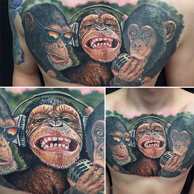 Colored Chimpanzee Tattoos On Man Chest
